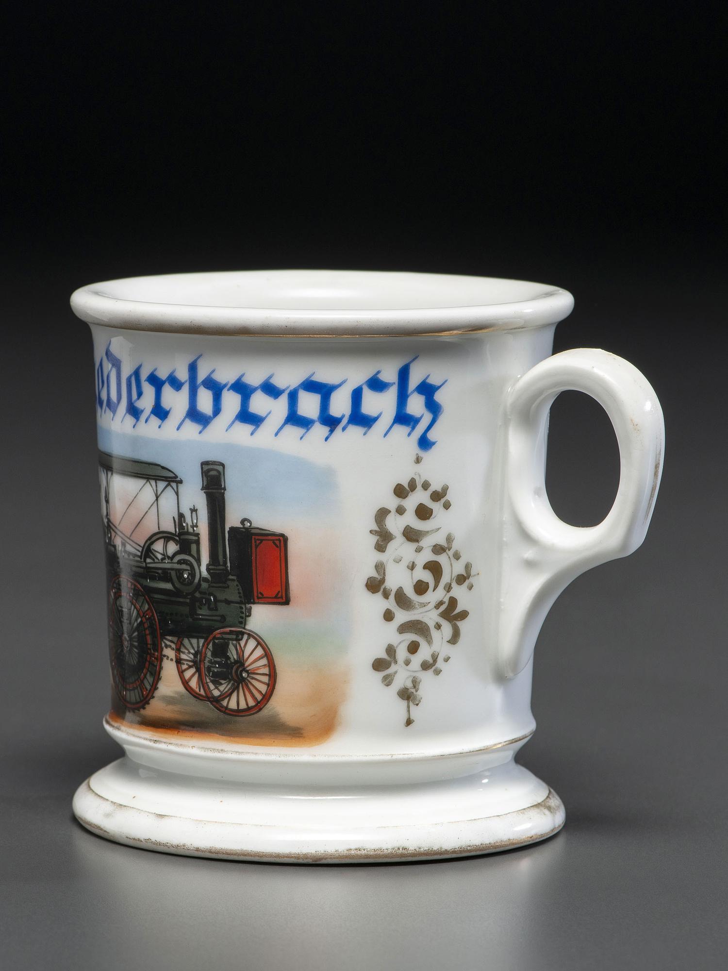 A Porcelain Shaving Mug Depicting a Steam-Powered Tractor