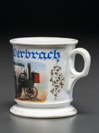 A Porcelain Shaving Mug Depicting a Steam-Powered Tractor