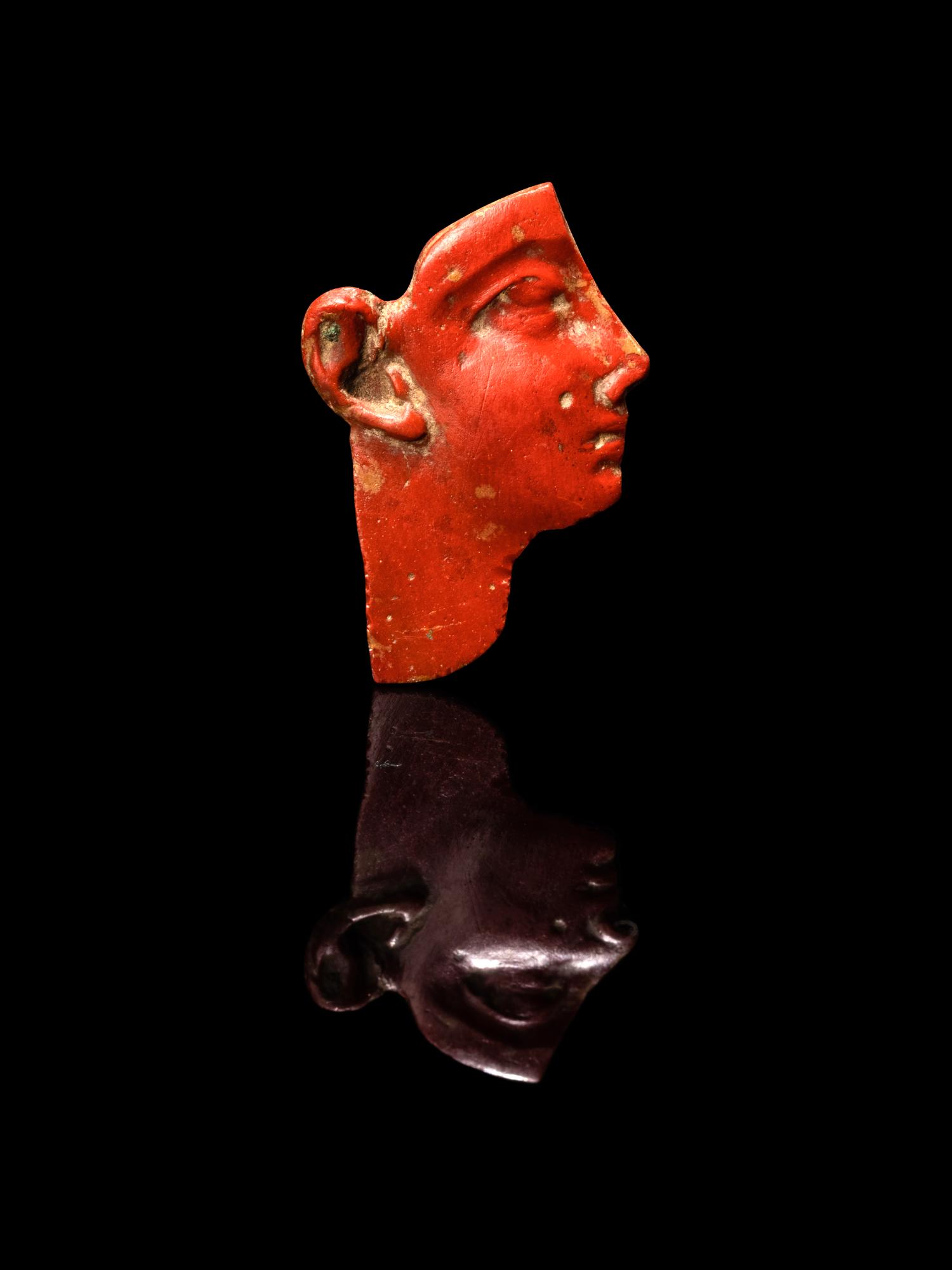 An Egyptian Red Jasper Face Inlay