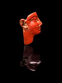 An Egyptian Red Jasper Face Inlay