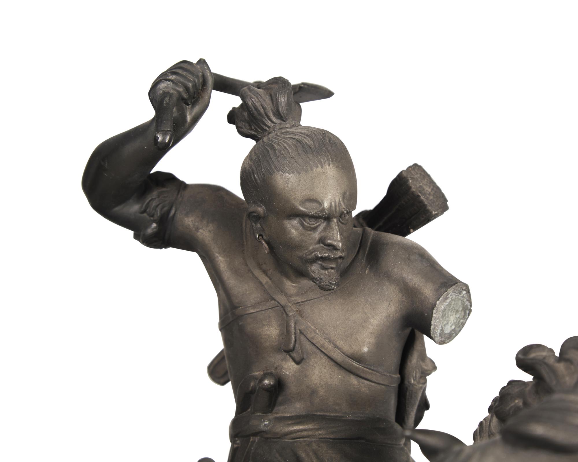 A Patinated White Metal Figure of a Native American Hunter on Horseback