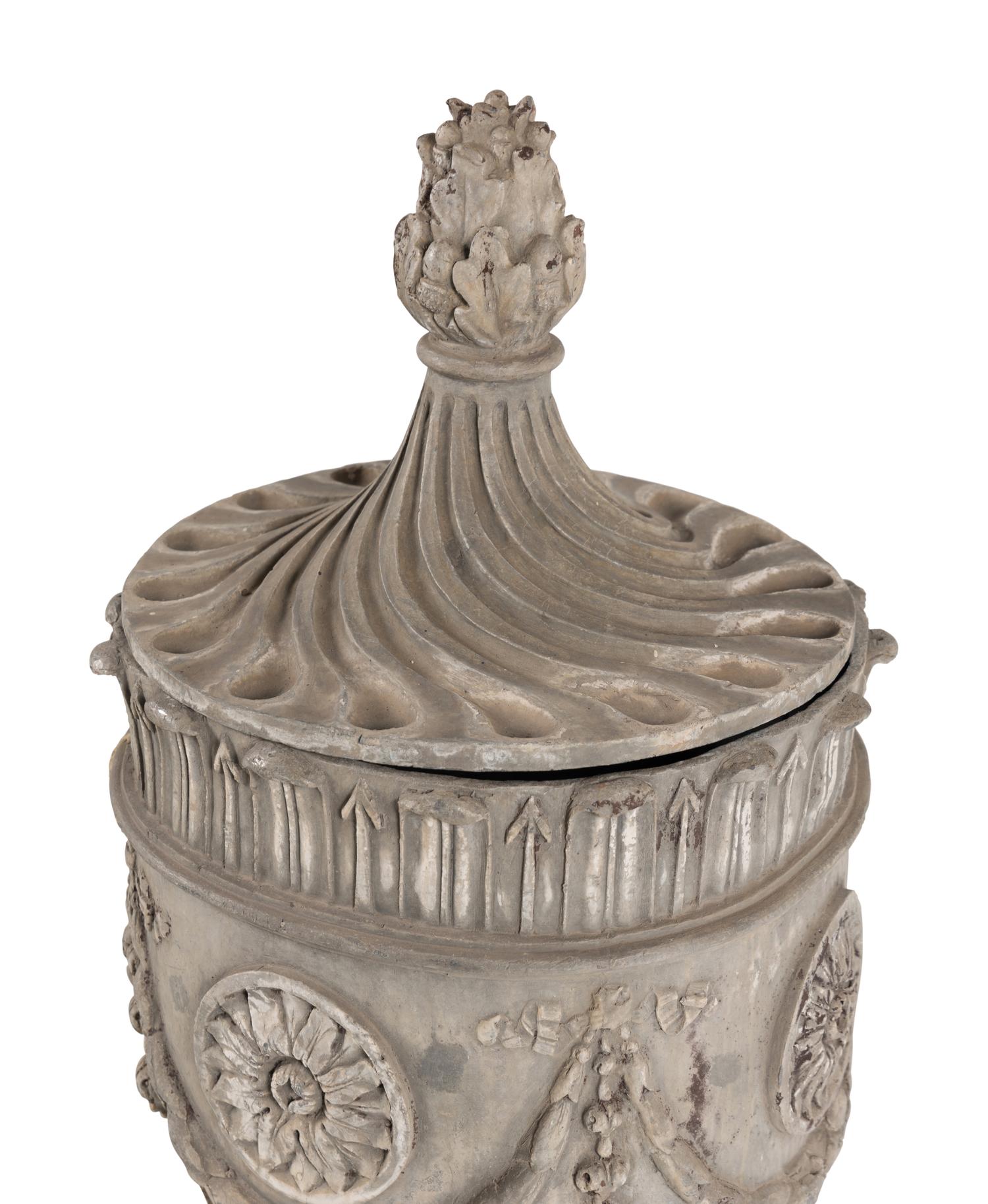 A Pair of Lead Garden Urns and Covers