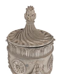 A Pair of Lead Garden Urns and Covers