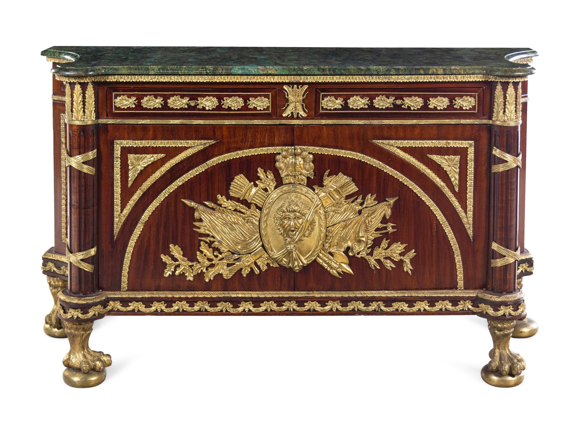 A Louis XVI Style Gilt Metal Mounted Mahogany Commode à Vantaux After the Model by Guillaume Benneman