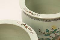 A Pair of Chinese Porcelain Jardinieres with Gilt Bronze Bases