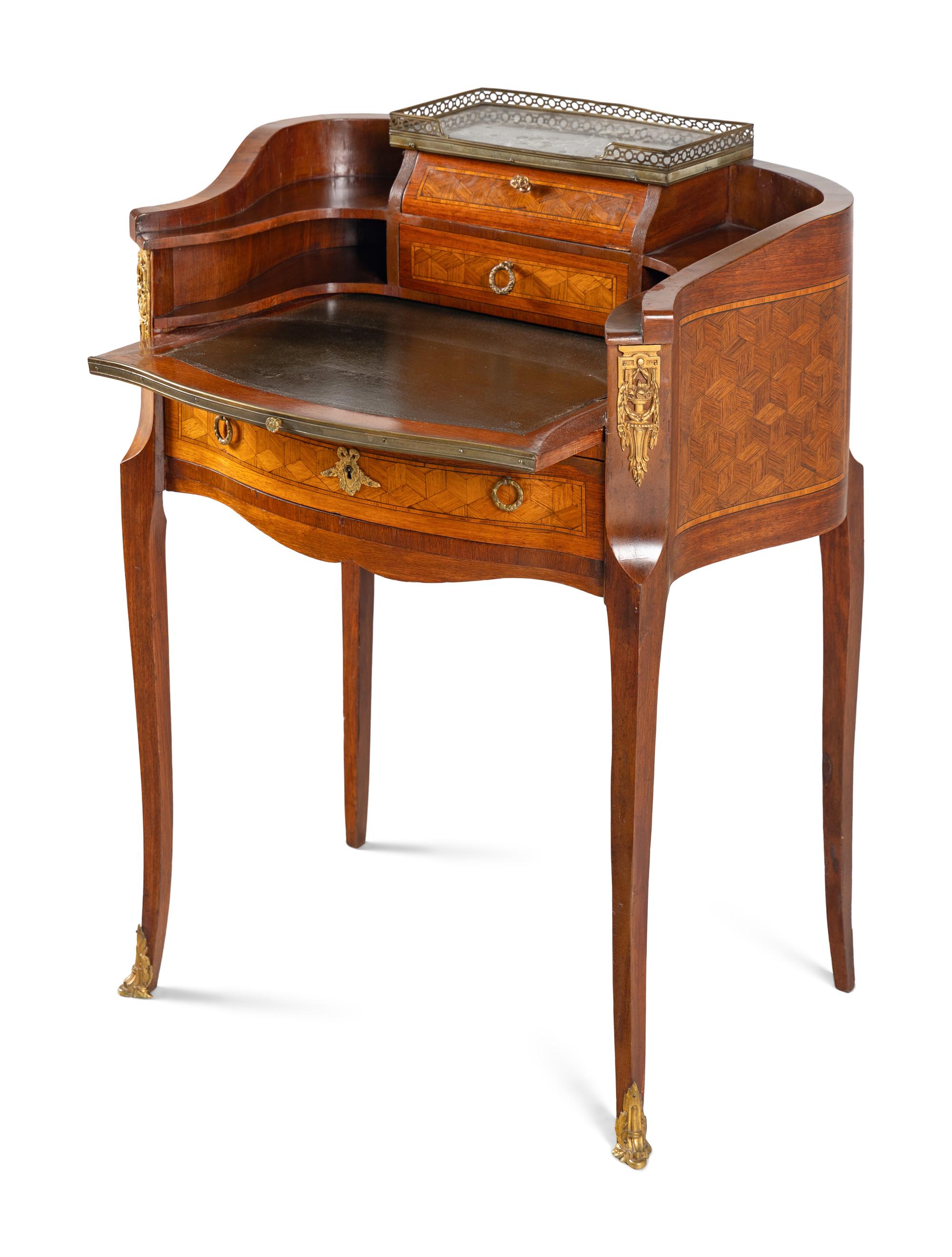 A Louis XV/XVI Transitional Style Gilt Metal Mounted Parquetry Writing Table