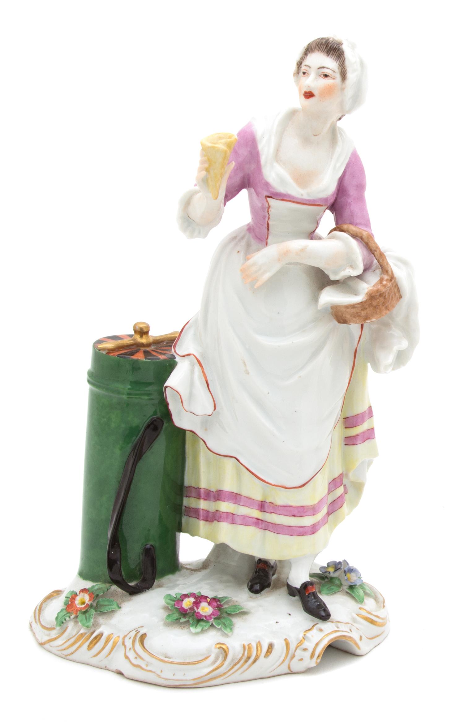 A German Porcelain Figure of a Female Street Vendor Height 8 3/4 inches. — 19TH CENTURY