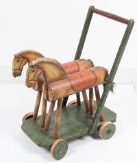 A Victorian Style Child's Push Cart Height 19 1/2 x width 15 inches.