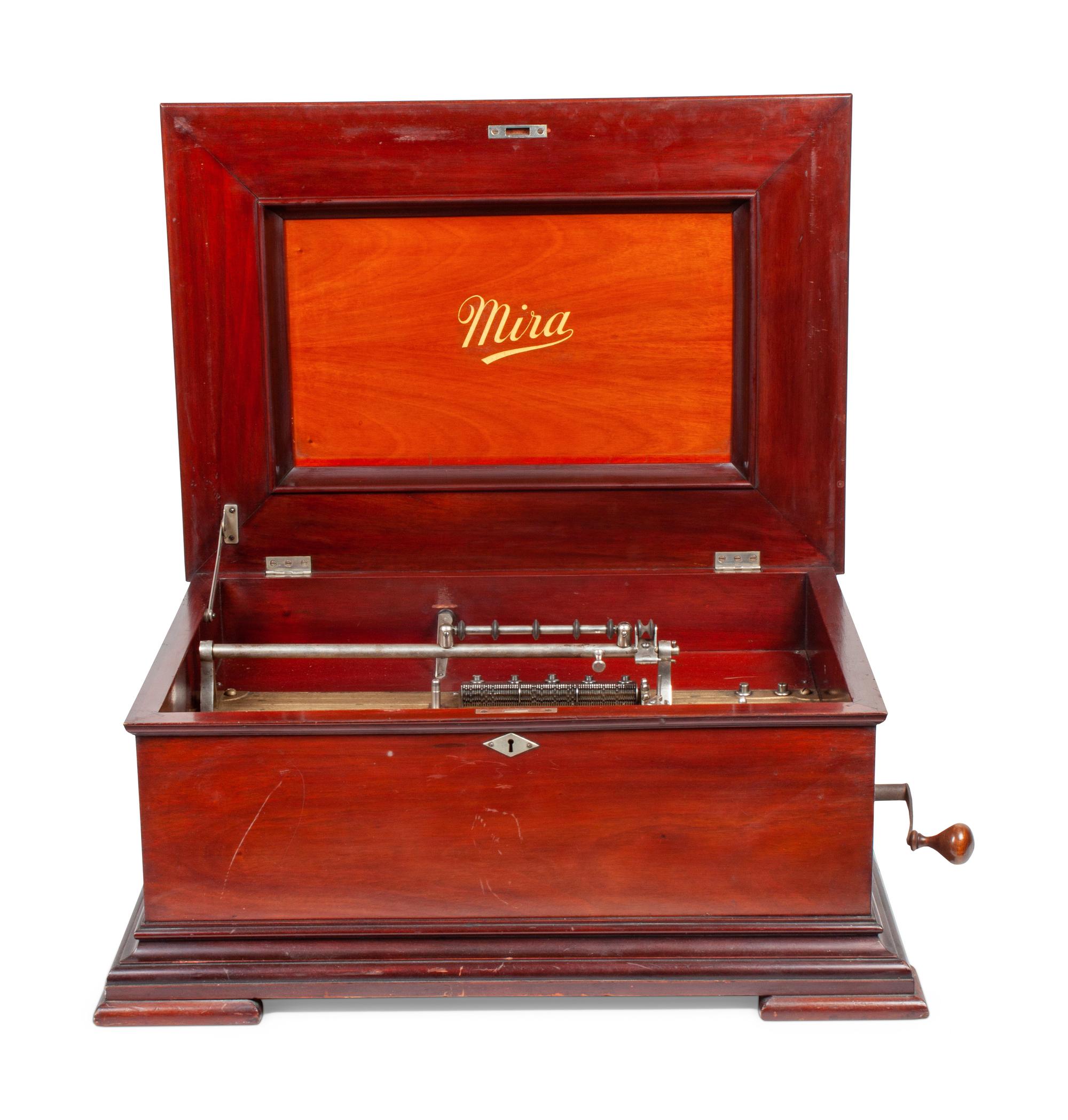 A Mira 15 1/2 Inch Disc Music Box and Seventeen Discs