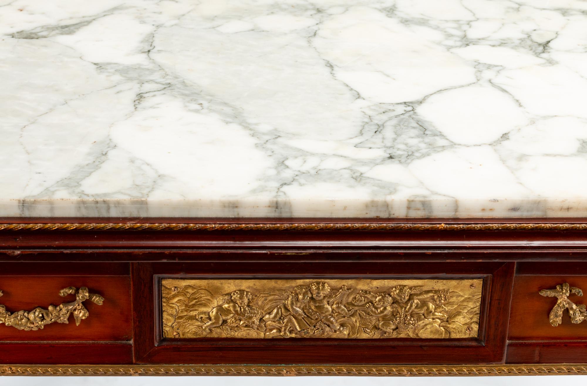 A Louis XVI Style Gilt Bronze Mounted Mahogany Marble-Top Center Table