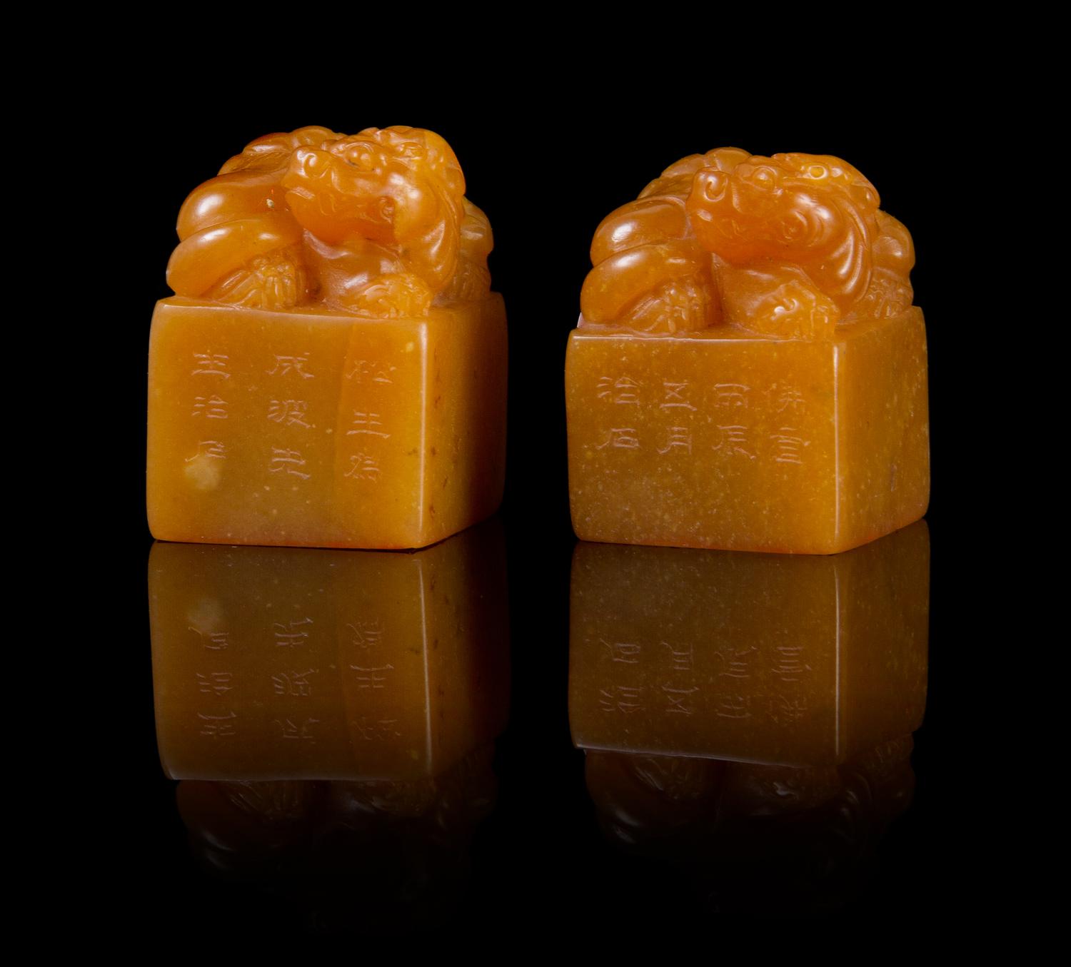 A Pair of Soapstone Seals Height of pair 1 5/8 inches.