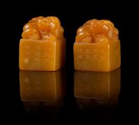 A Pair of Soapstone Seals Height of pair 1 5/8 inches.