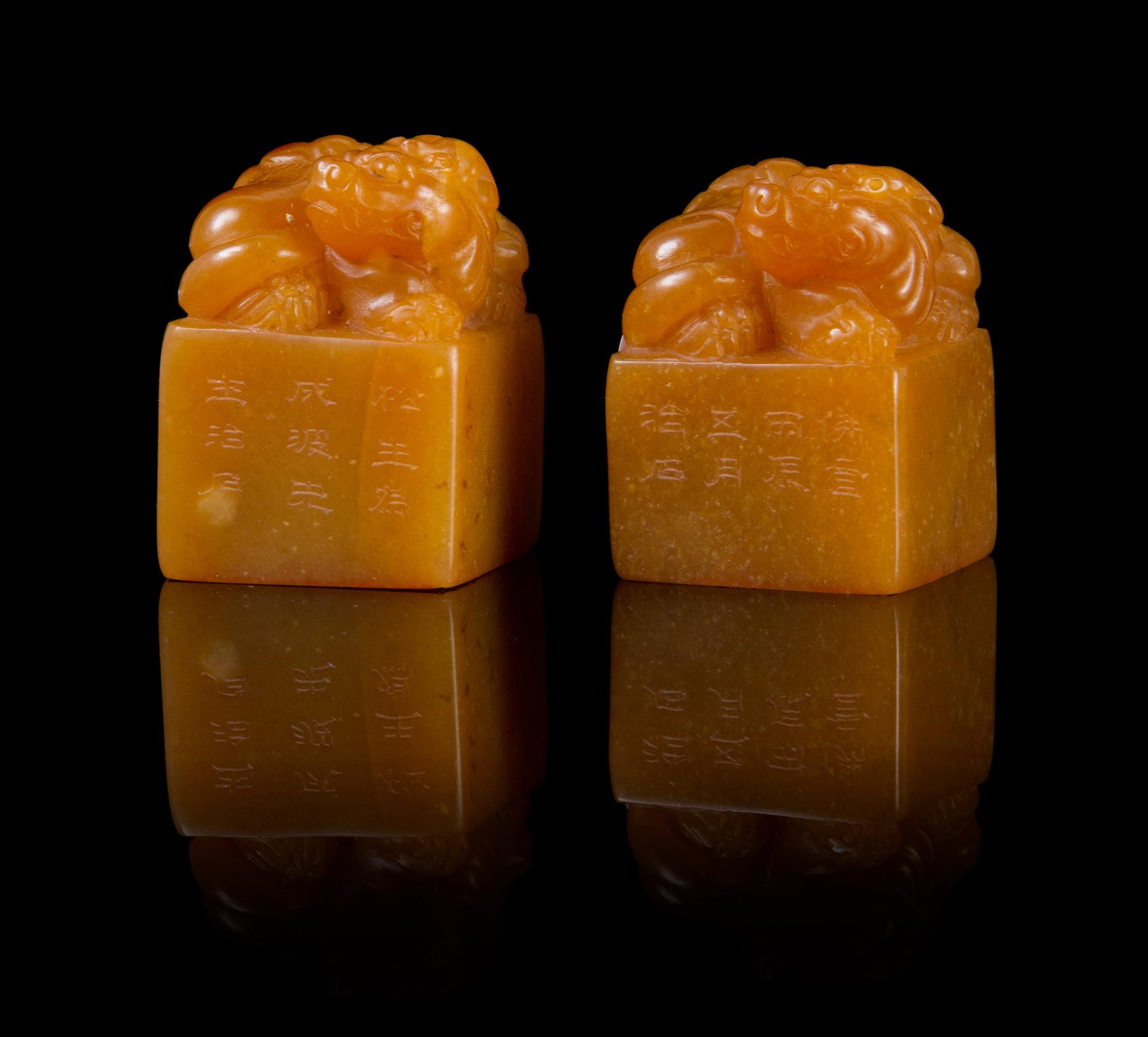 A Pair of Soapstone Seals Height of pair 1 5/8 inches.