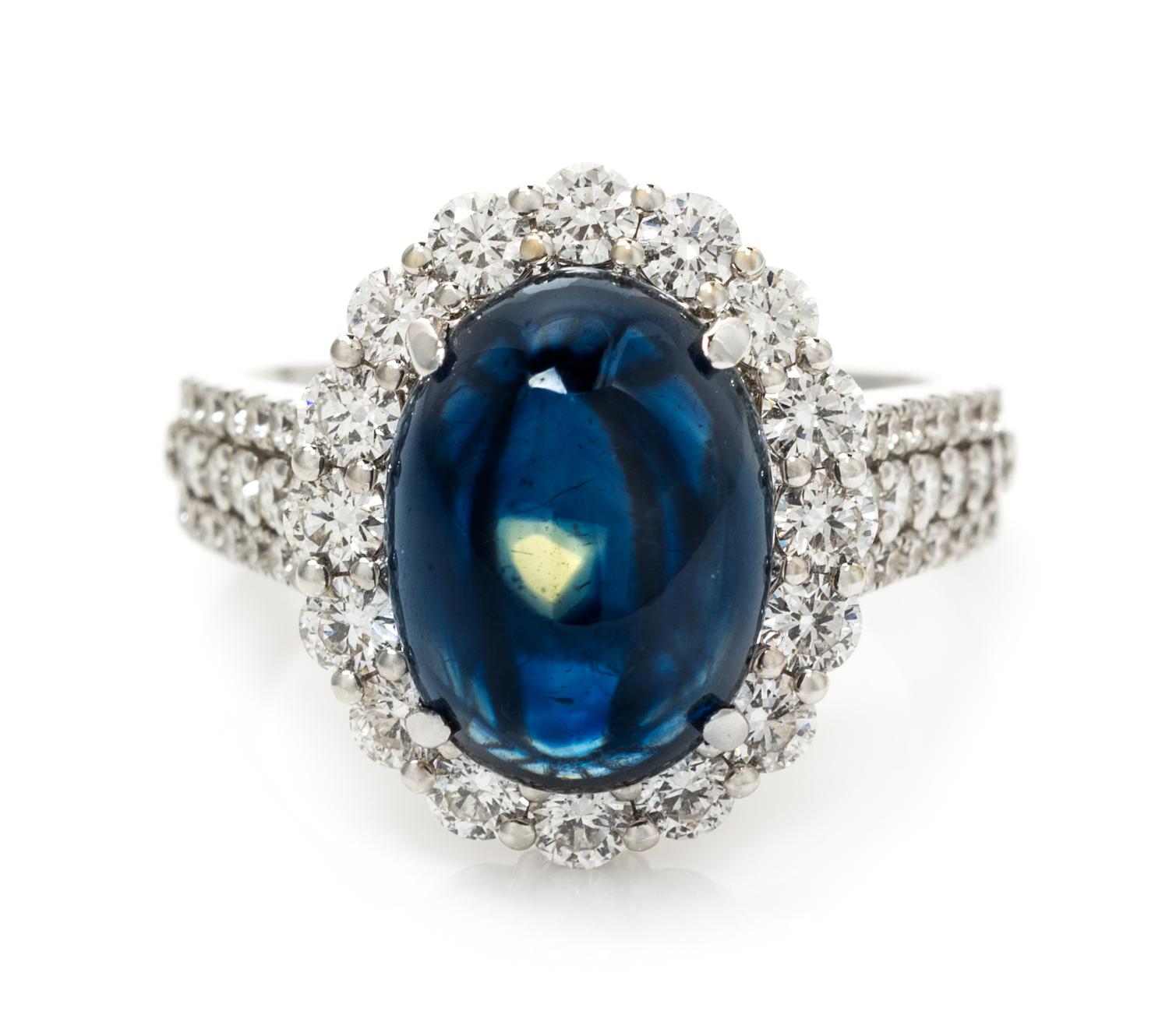 An 18 Karat White Gold, Sapphire and Diamond Ring, 4.90 dwts.