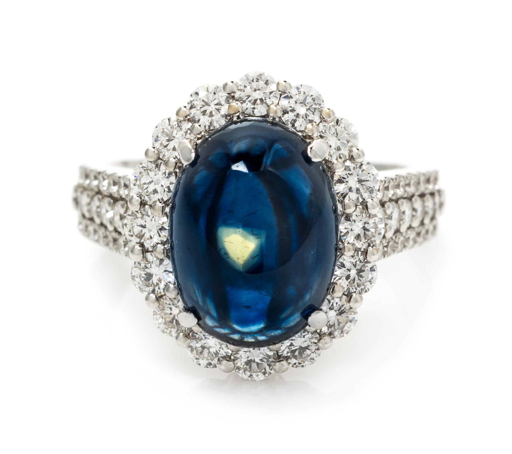 An 18 Karat White Gold, Sapphire and Diamond Ring, 4.90 dwts.