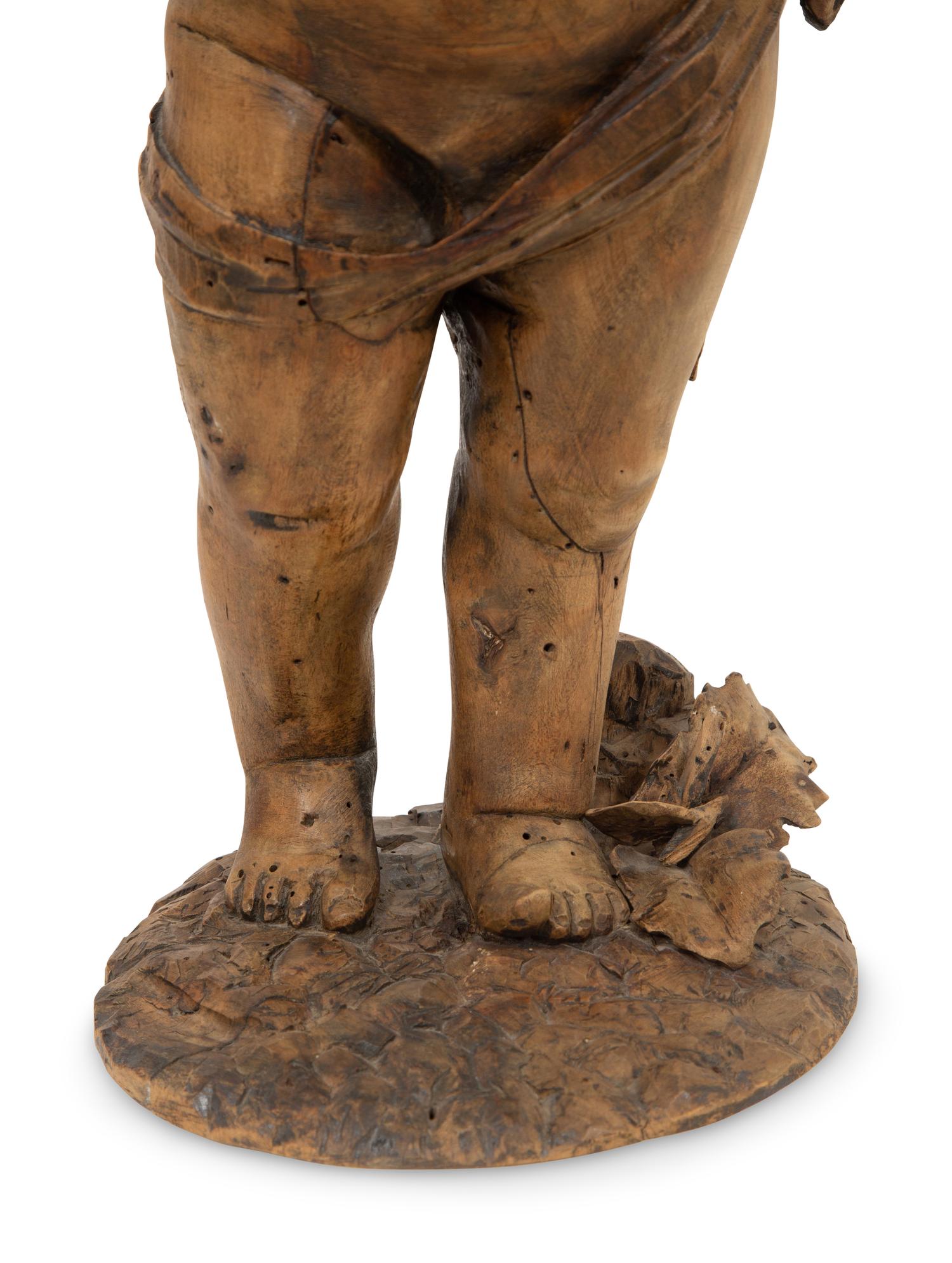 A Flemish Carved Wood Putto
