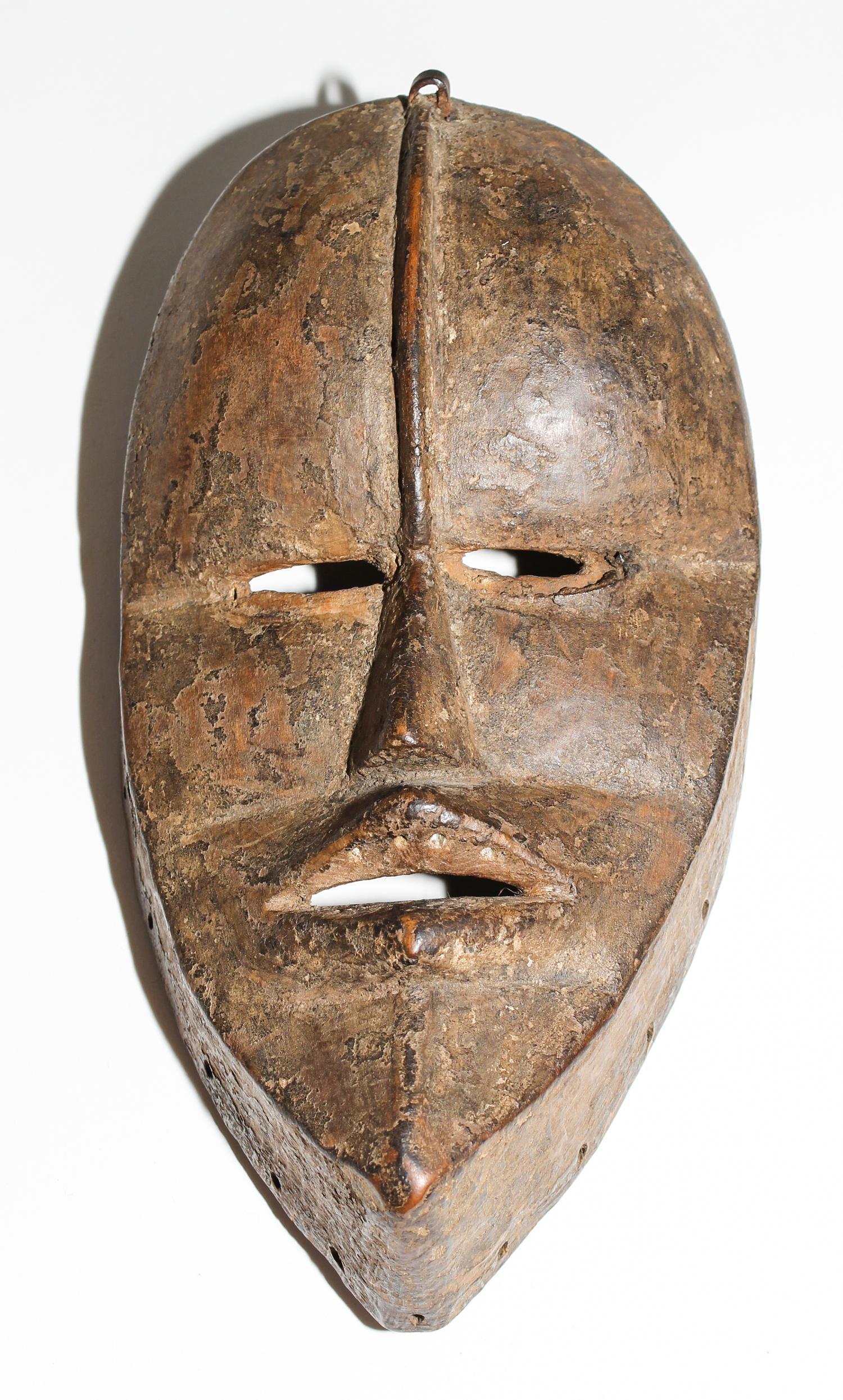 A Dan Poro Society Mask. Height 9 1/4 inches.