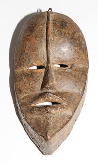 A Dan Poro Society Mask. Height 9 1/4 inches.