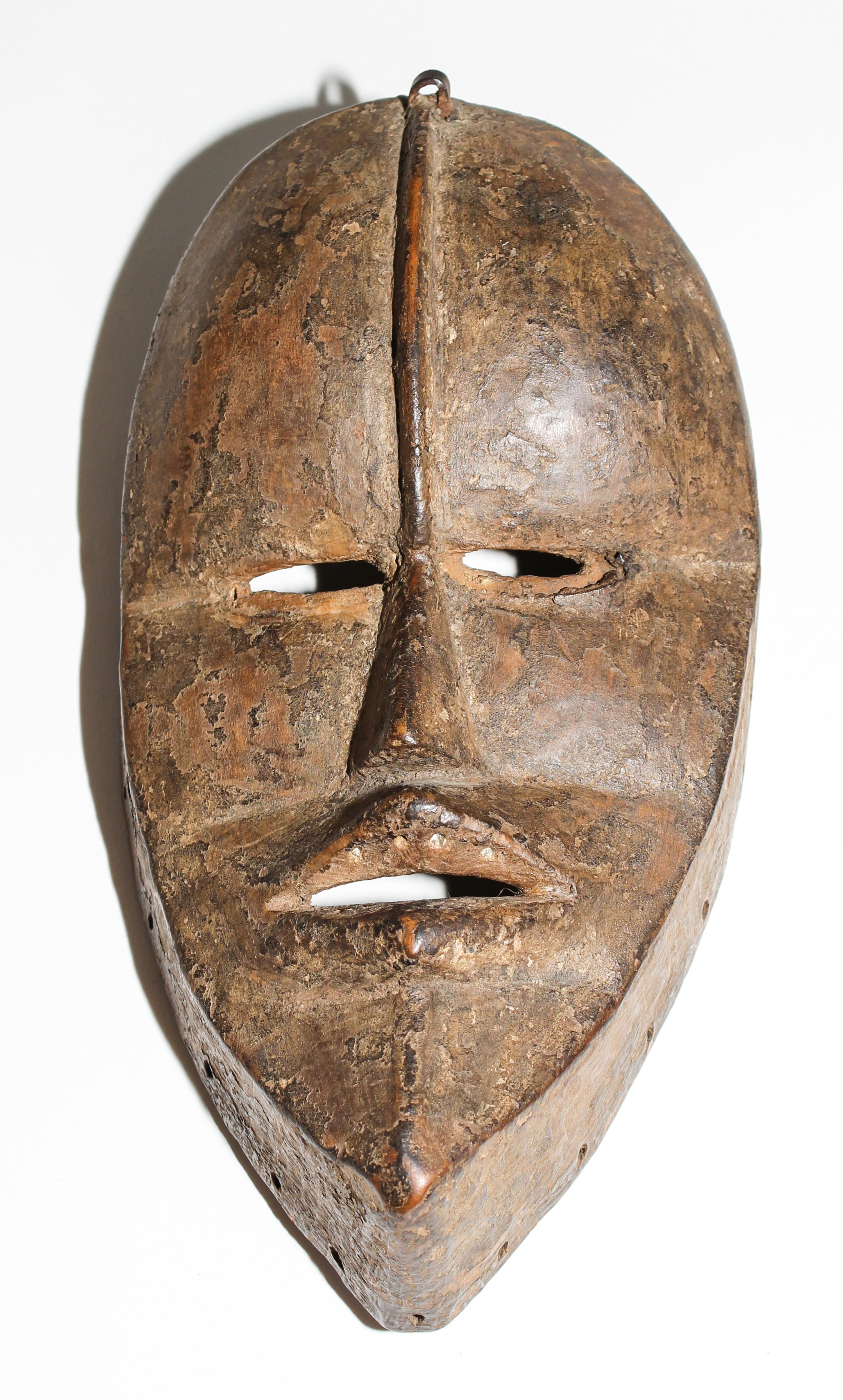 A Dan Poro Society Mask. Height 9 1/4 inches.