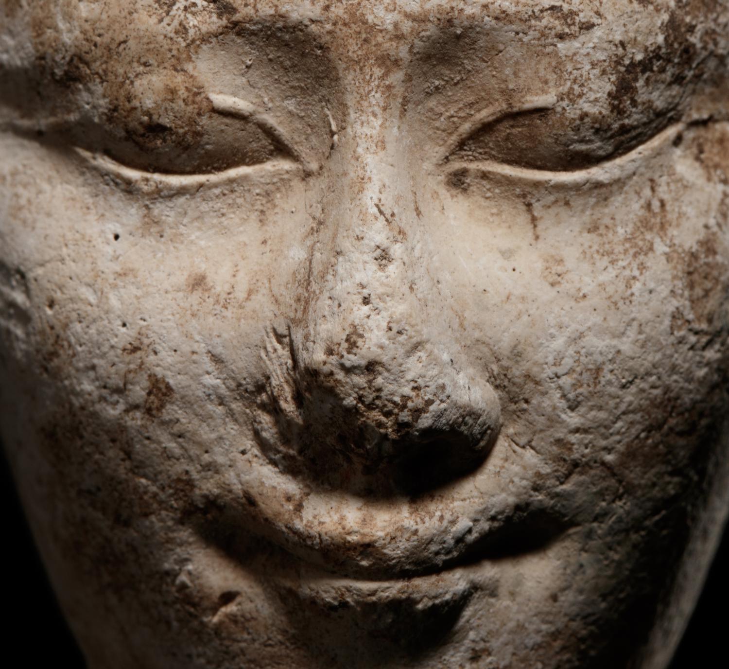 An Egyptian Limestone Head of a Noblewoman