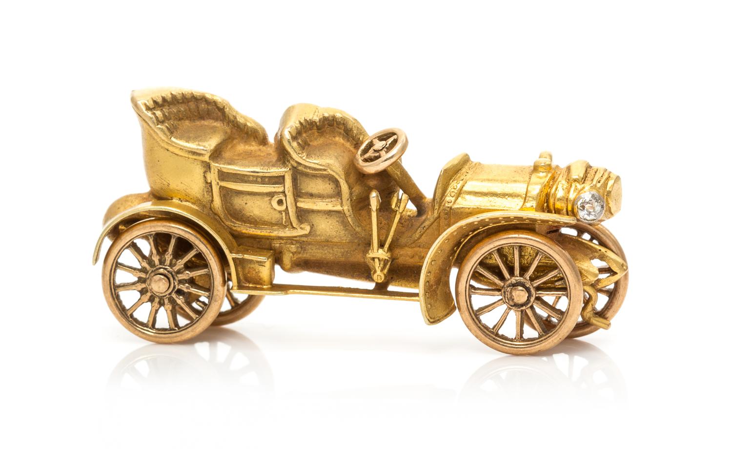 A Yellow Gold and Diamond Articulated Antique Car Brooch, Circa 1920, 5.30 dwts.