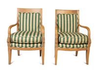 A Set of Twelve Directoire Style Carved Light Wood Dining Chairs — 20TH CENTURY