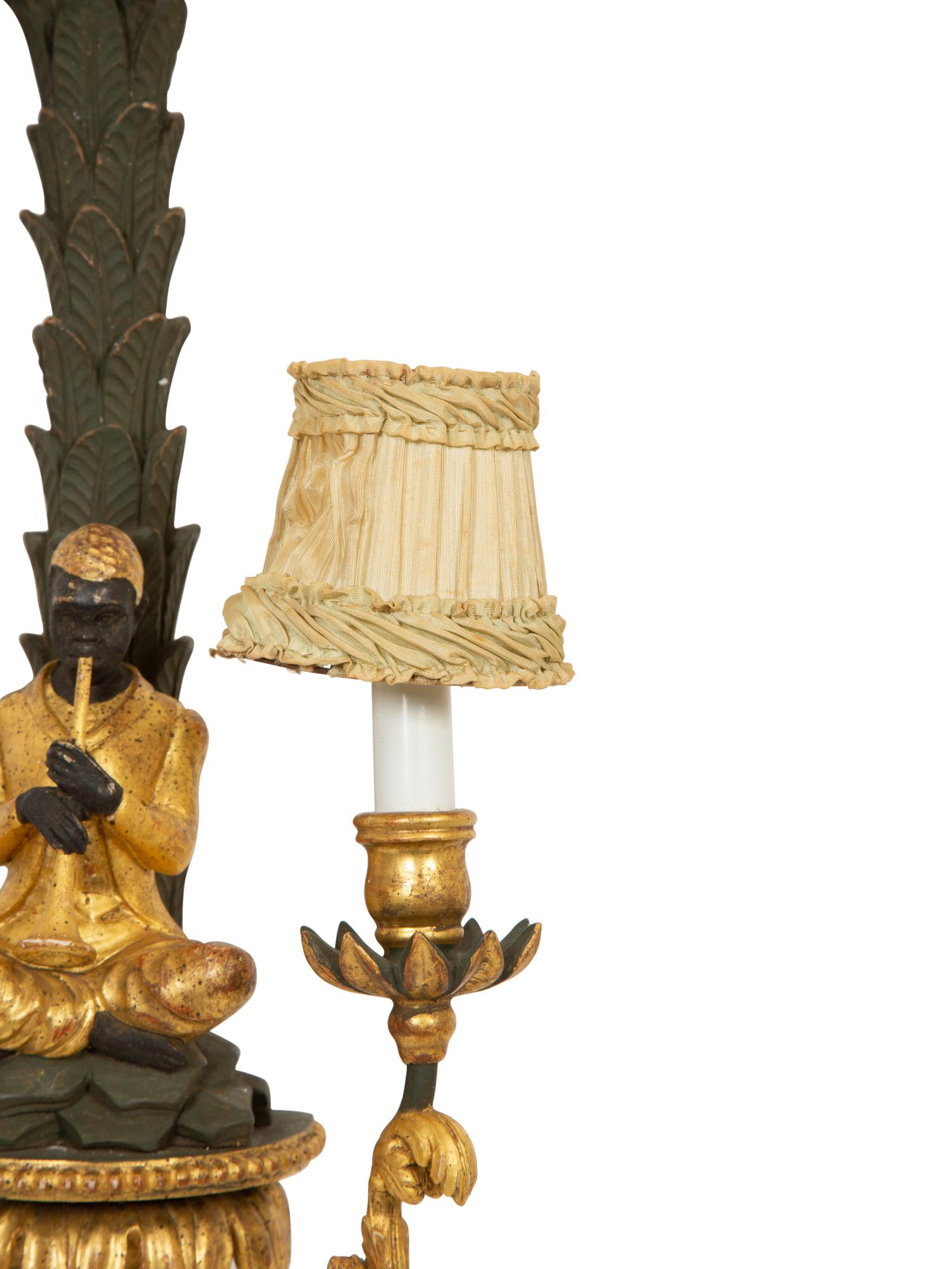 A Pair of Painted and Parcel Gilt Carved Wood Sconces