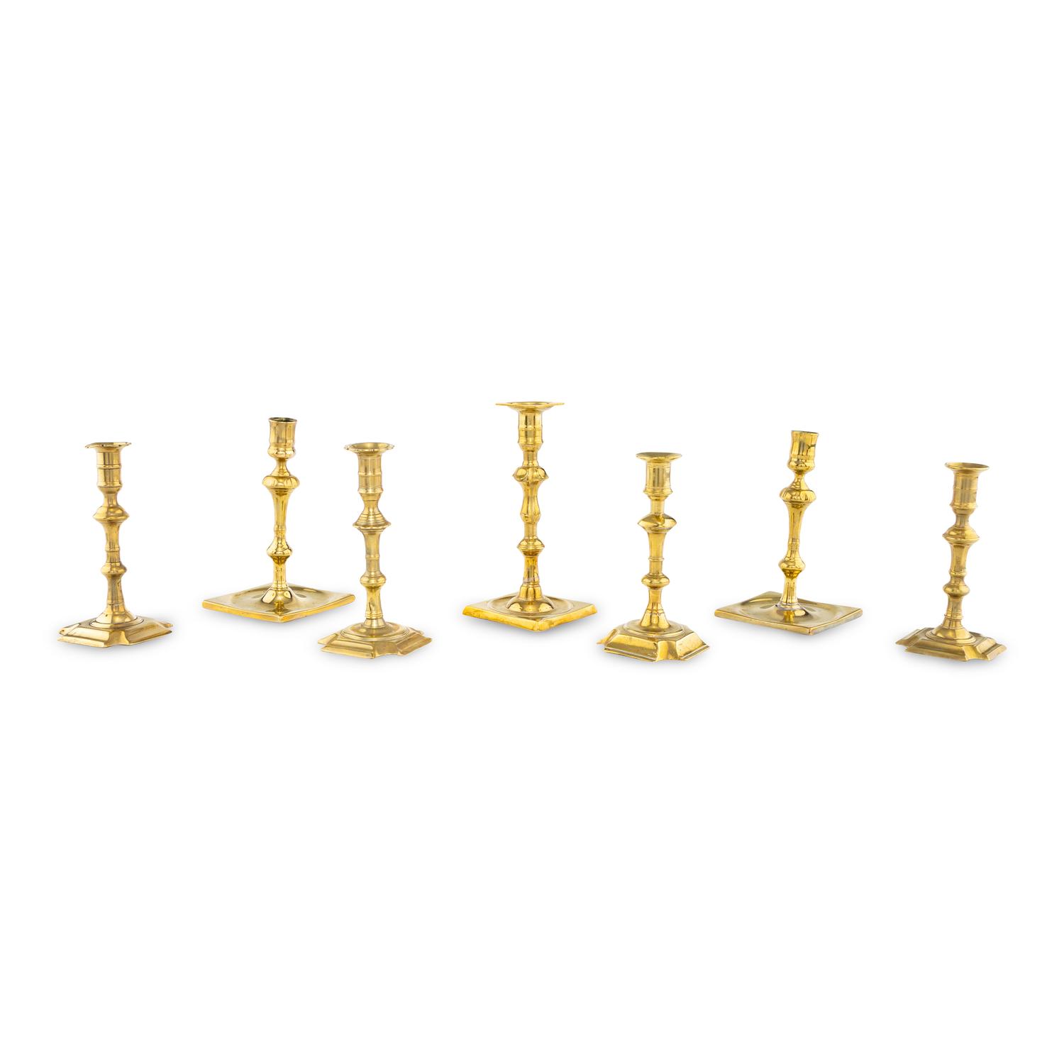 A Group of Seven Brass Candlesticks