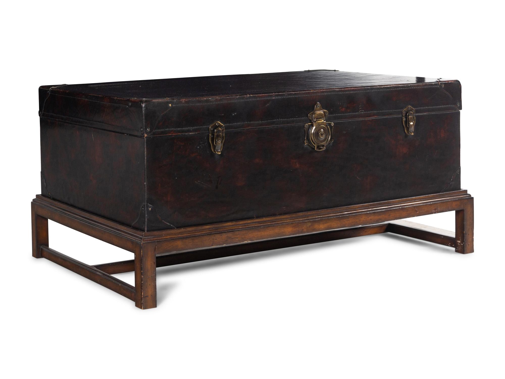 A Leather-Veneered Trunk on a Later Stand