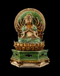A Chinese Sancai Glazed Stoneware Figure of Seated Guanyin