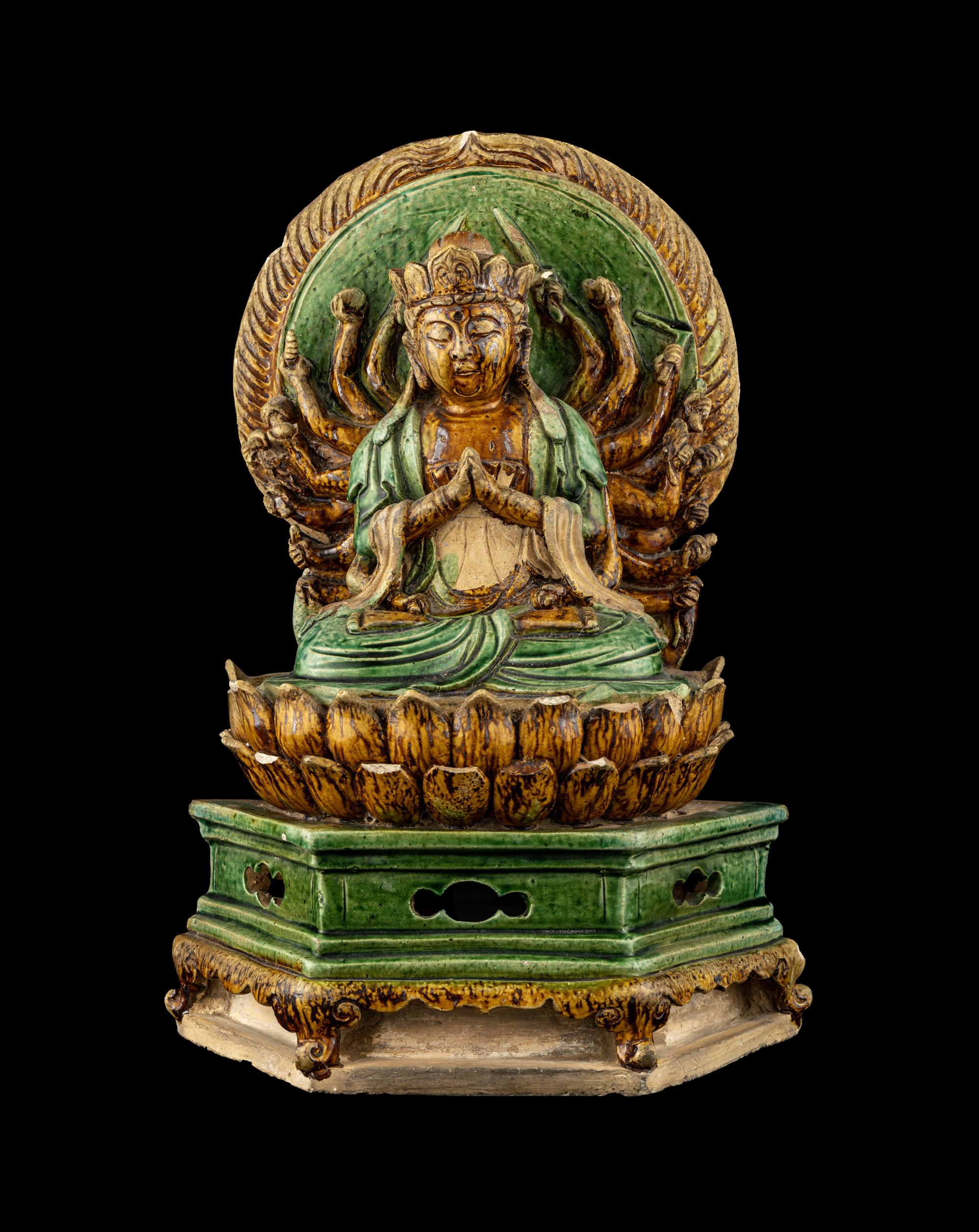 A Chinese Sancai Glazed Stoneware Figure of Seated Guanyin