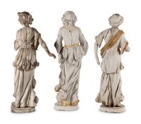 A Set of Three Carved, Painted and Parcel Gilt Wood Figures