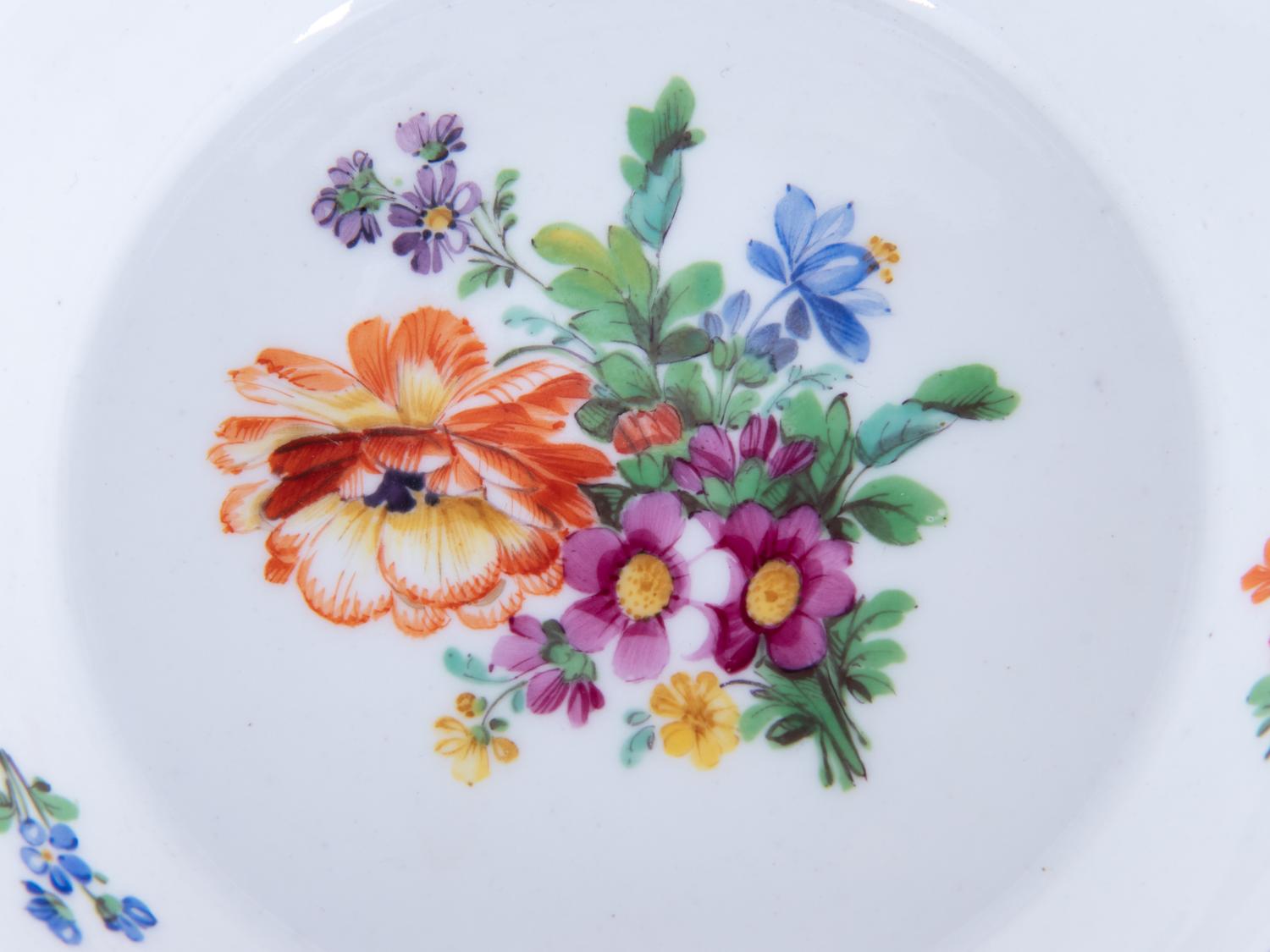 Three Meissen Painted and Parcel Gilt Porcelain Cup and Saucer Sets, a Covered Cup and Two Spoons