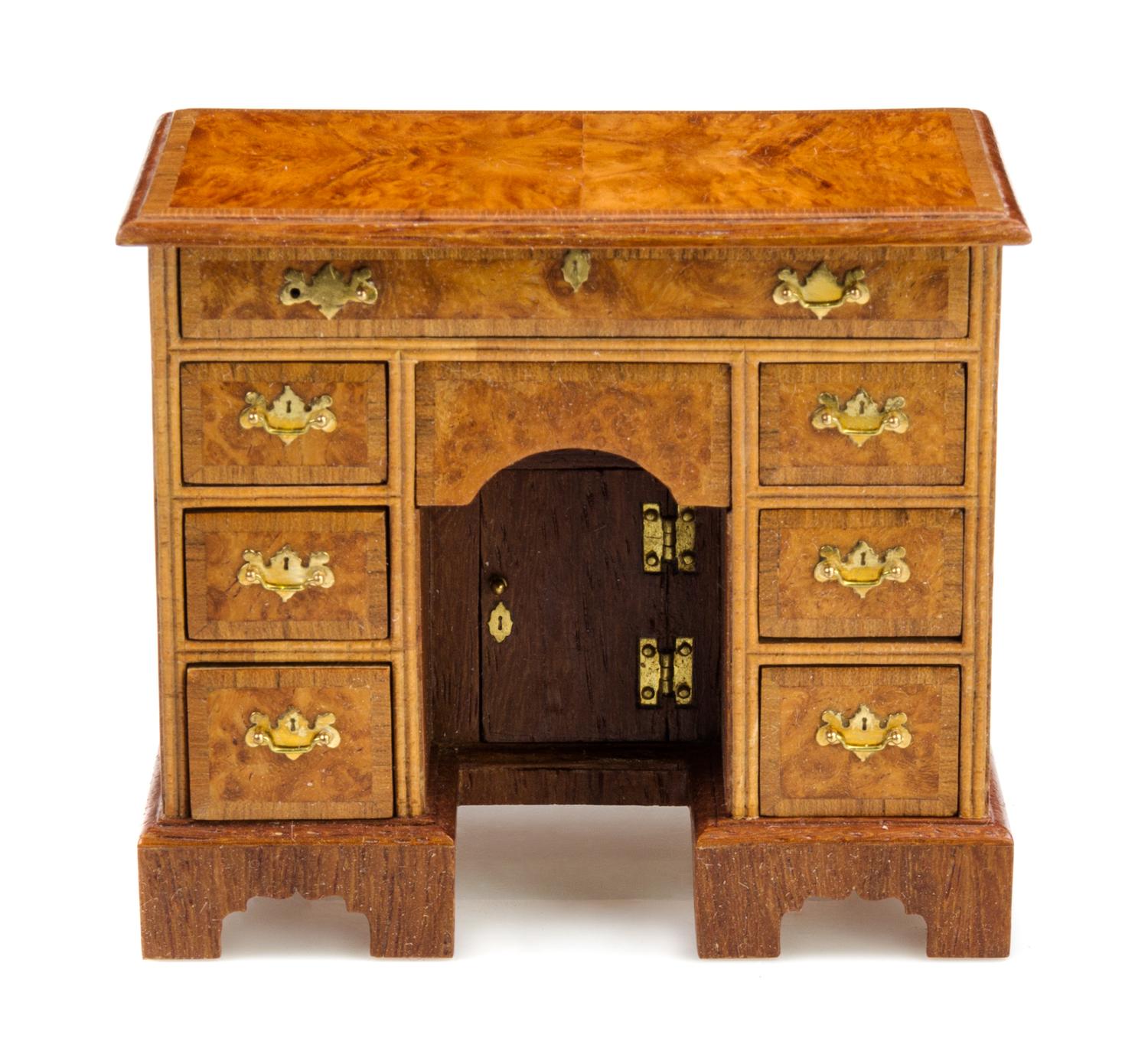 A George III Style Burlwood Kneehole Desk Height 2 1/2 x width 2 7/8 x depth 1 5/8 inches. — John J. Hodgson, 1997