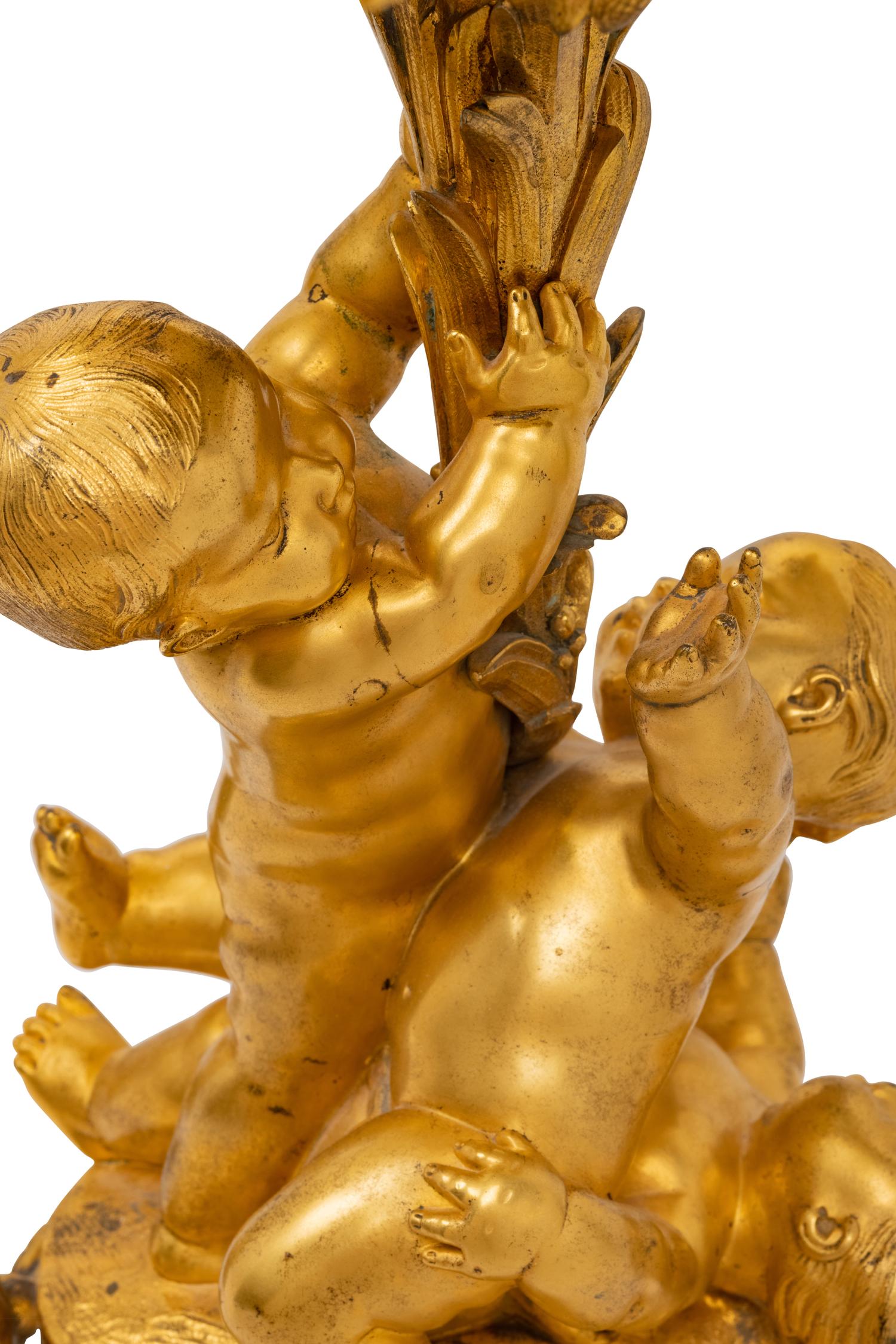 A Pair of Louis XV Style Gilt Bronze Figural Ten-Light Candelabra