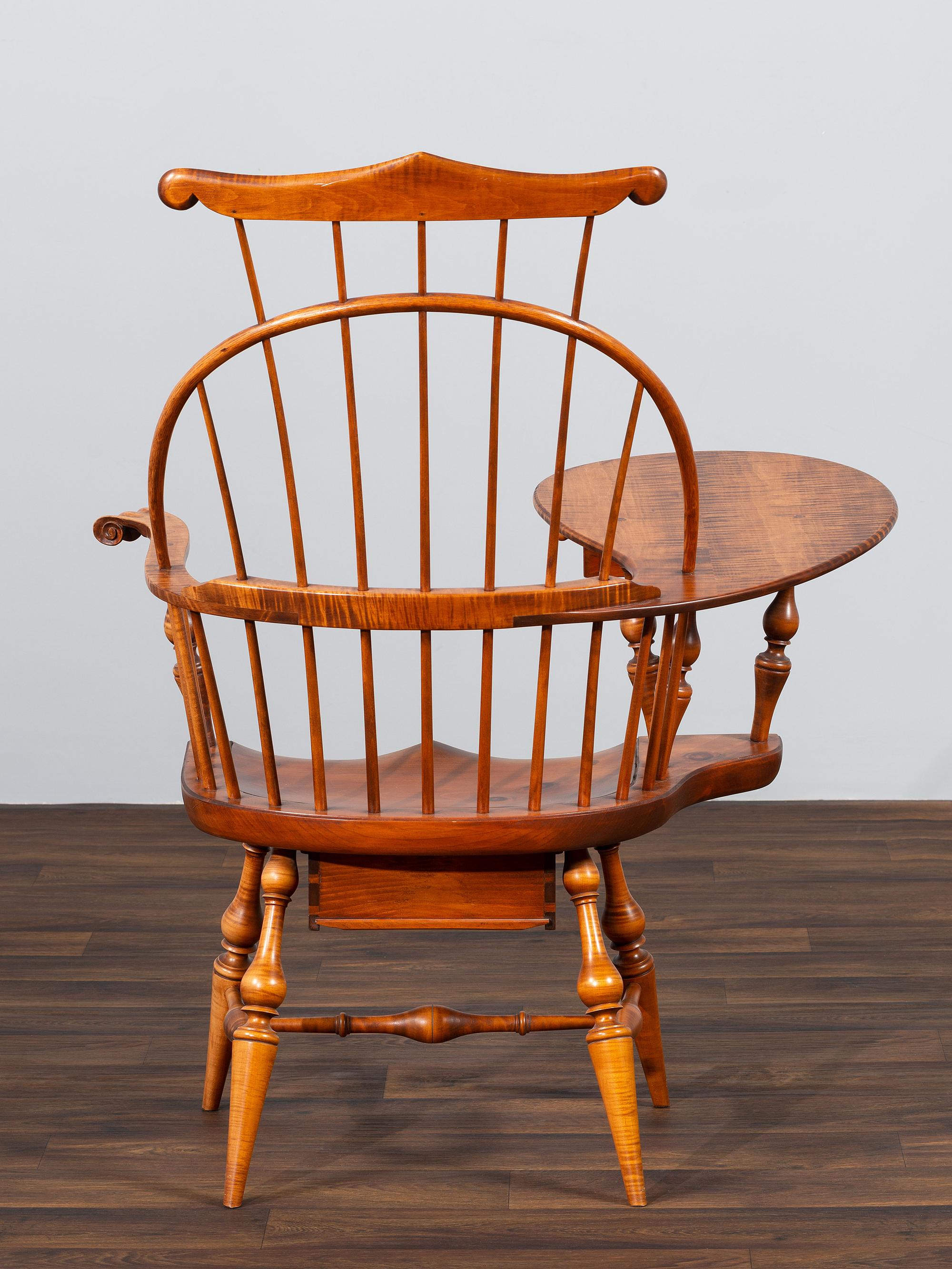 A D.R. Dimes Turned and Volute Carved Tiger Maple Windsor Three-Back Writing Armchair