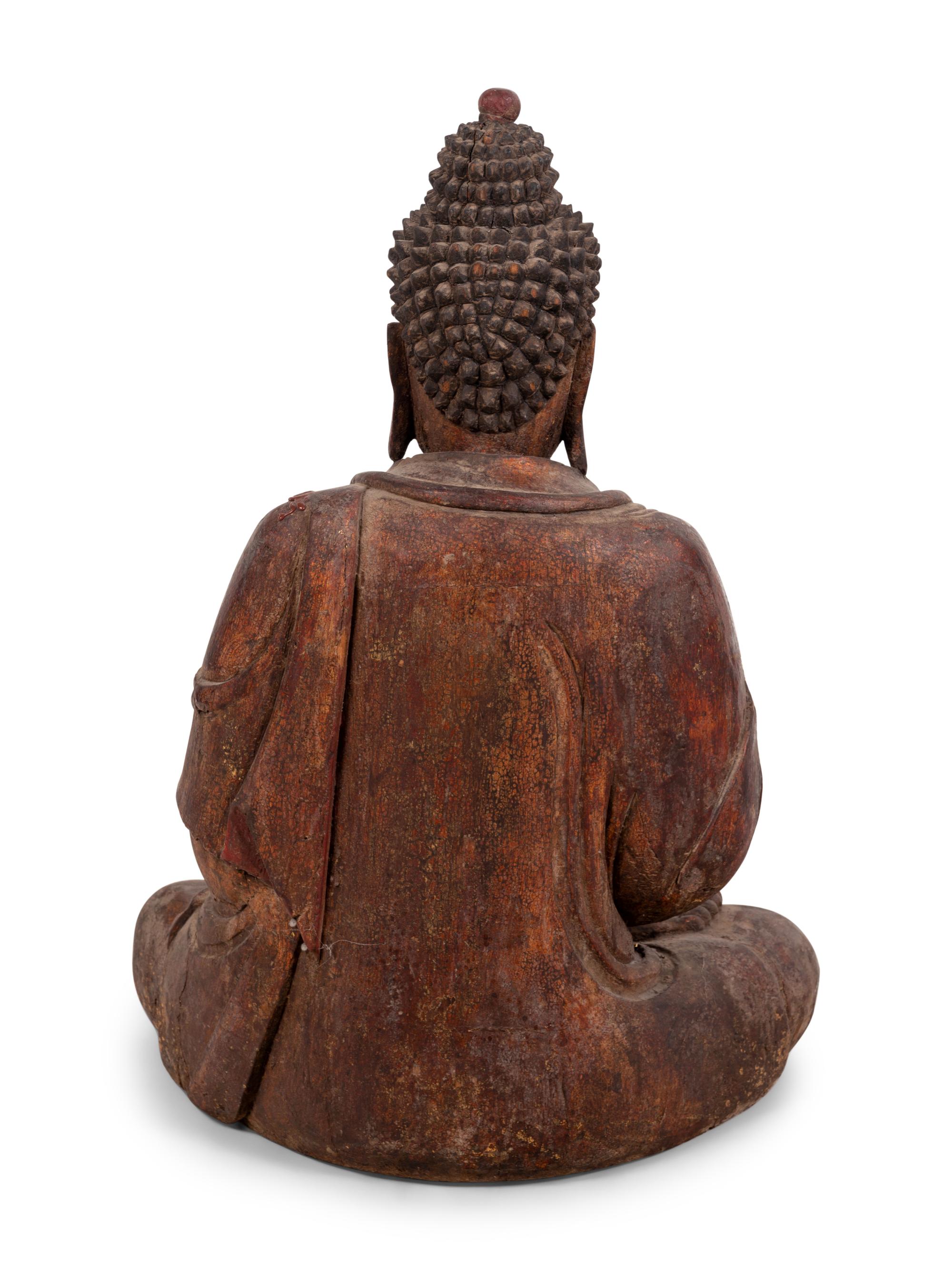 A Chinese Carved Wood Seated Buddha