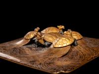 A Japanese Gold and Black Lacquer 'Dragon Turtle' Square Stand