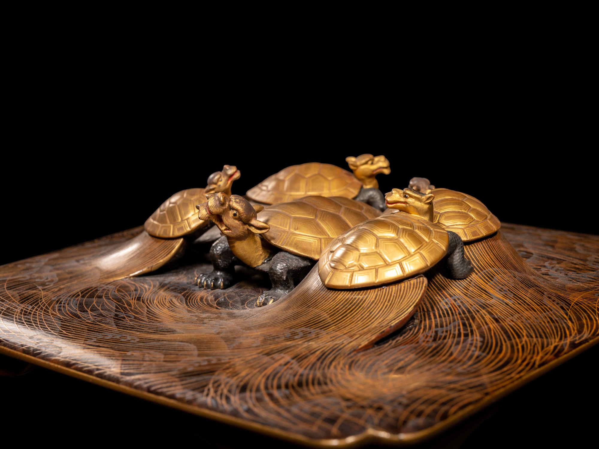 A Japanese Gold and Black Lacquer 'Dragon Turtle' Square Stand