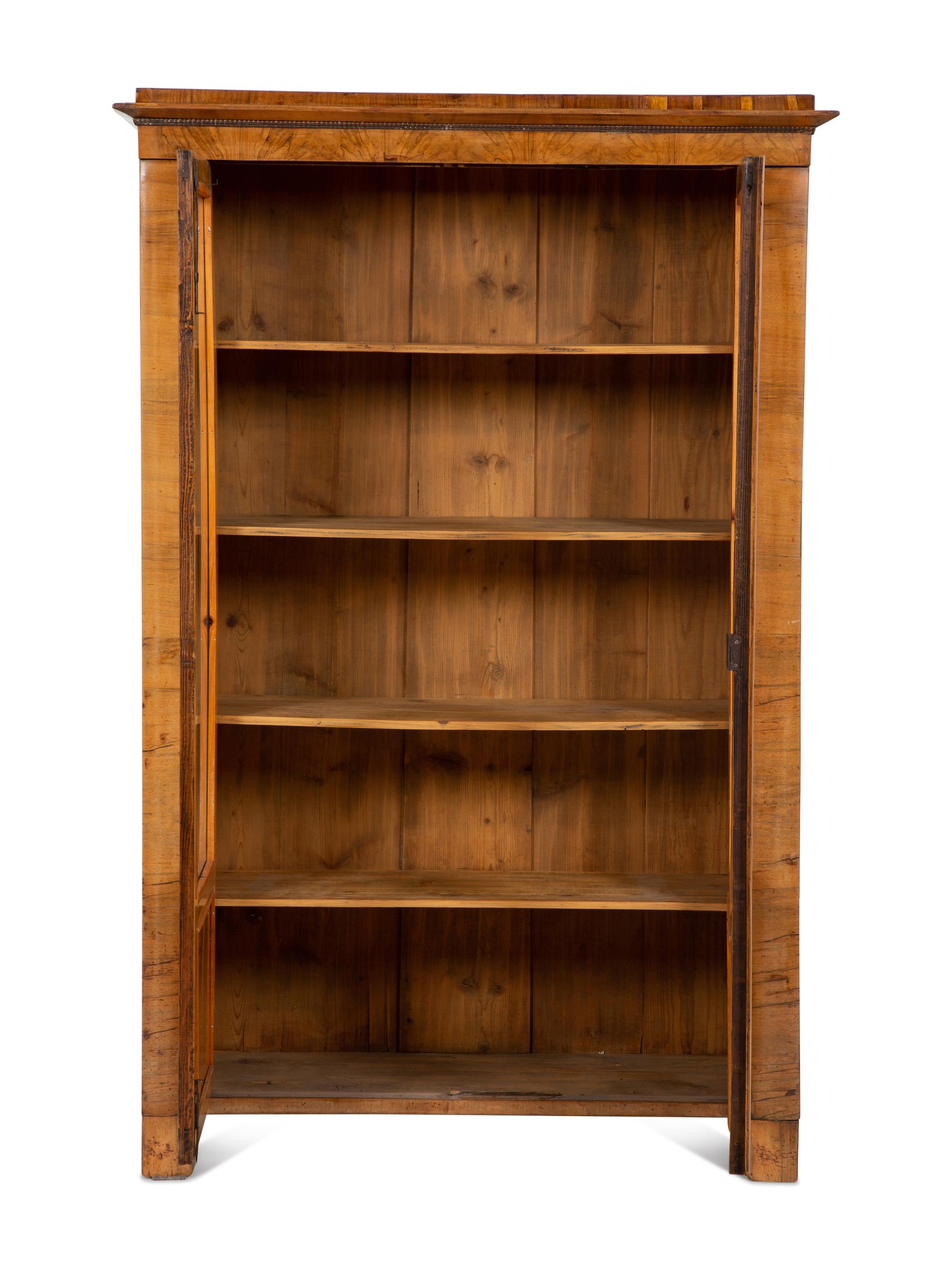 A Pair of Biedermeier Figured Birch Bookcases