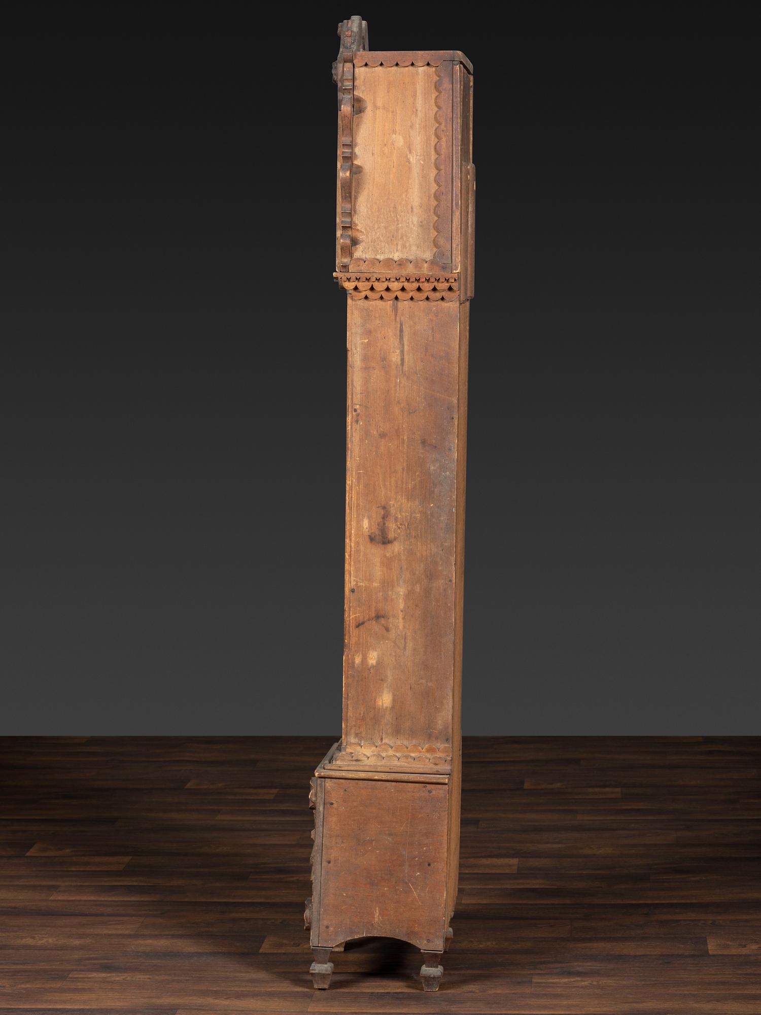 A Folk Art Carved Maple Clock Case