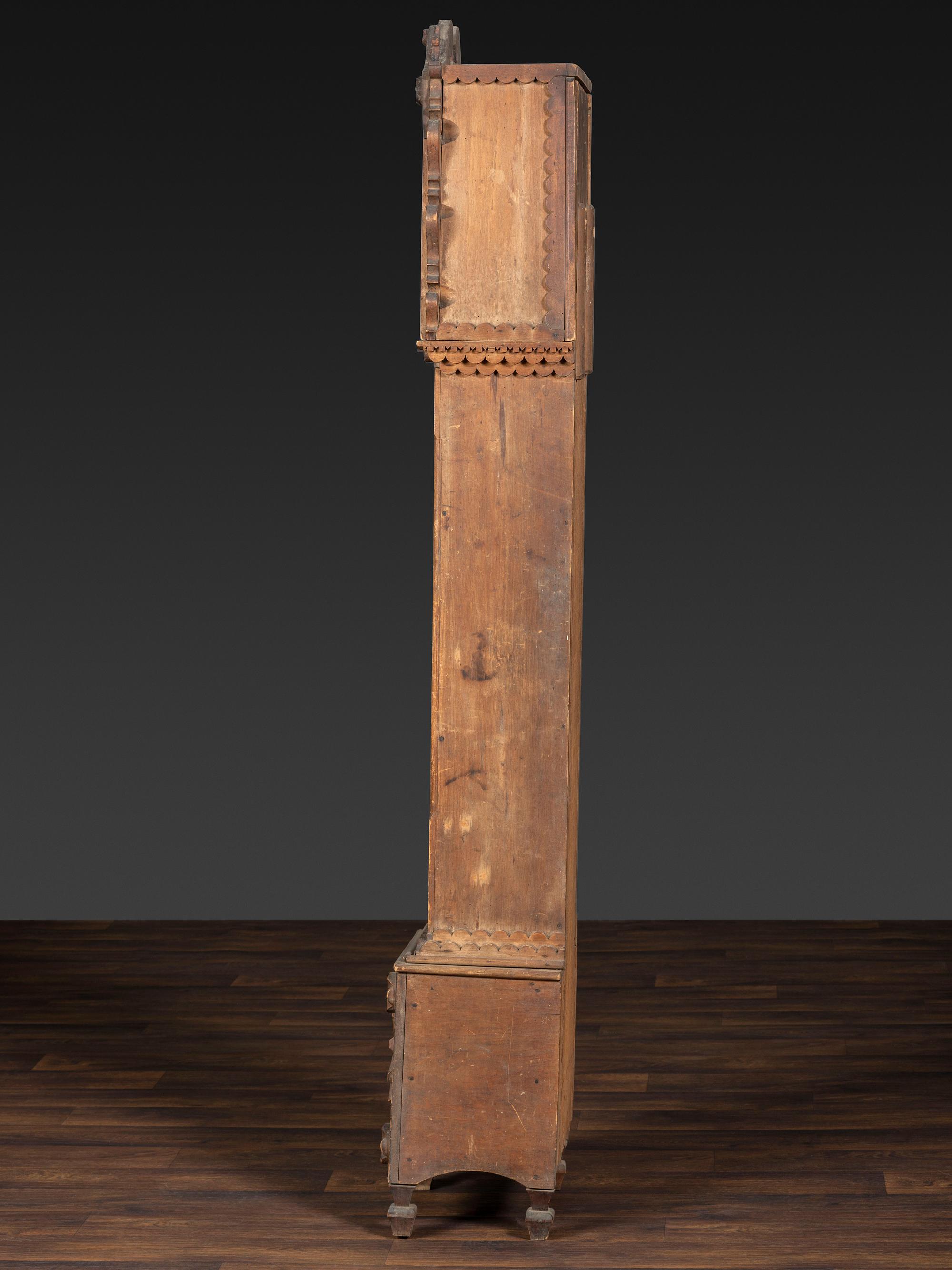 A Folk Art Carved Maple Clock Case