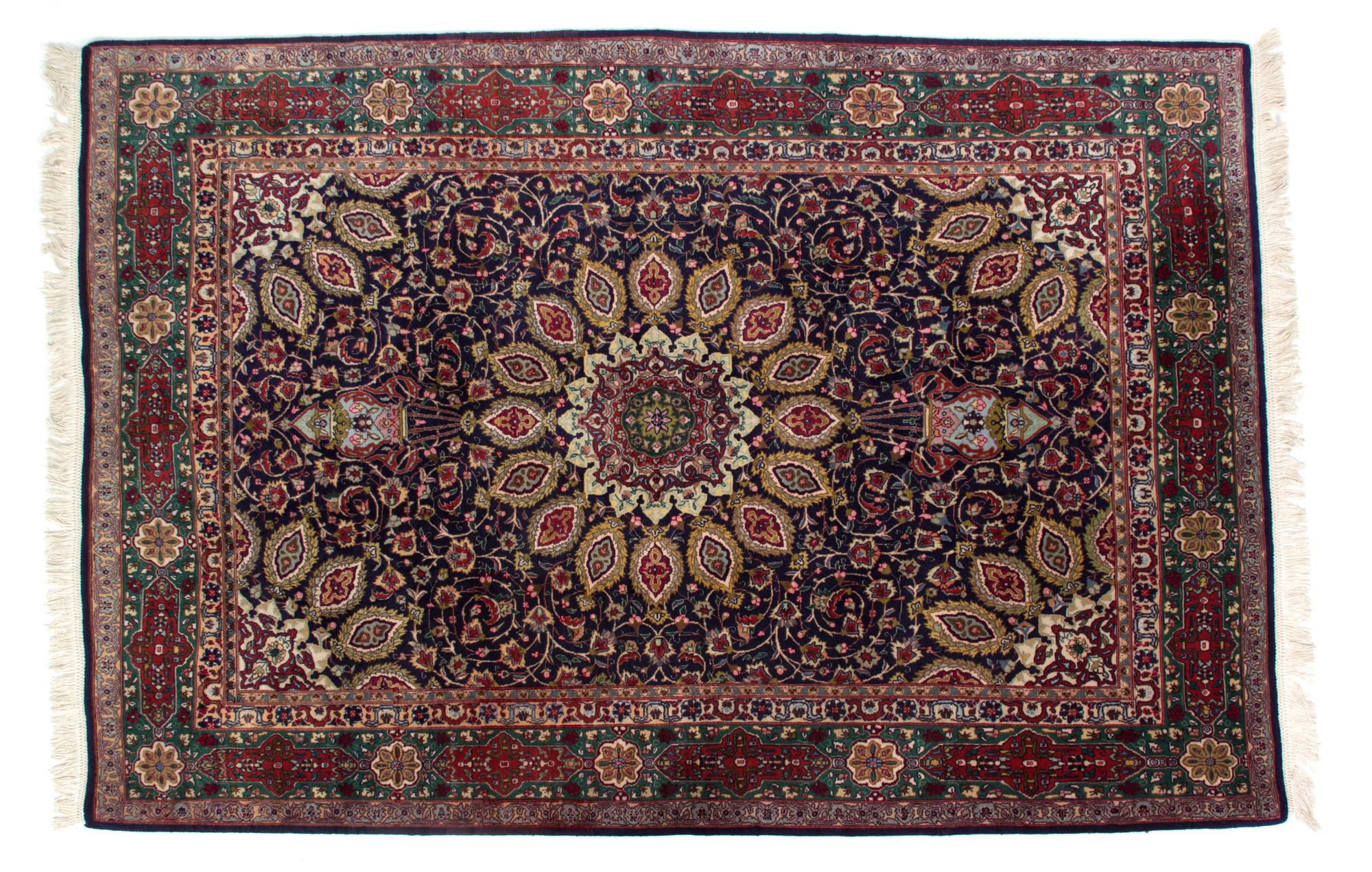 A Tabriz Wool and Silk Rug 8 feet 7 inches x 4 feet 7 inches. — 20TH CENTURY