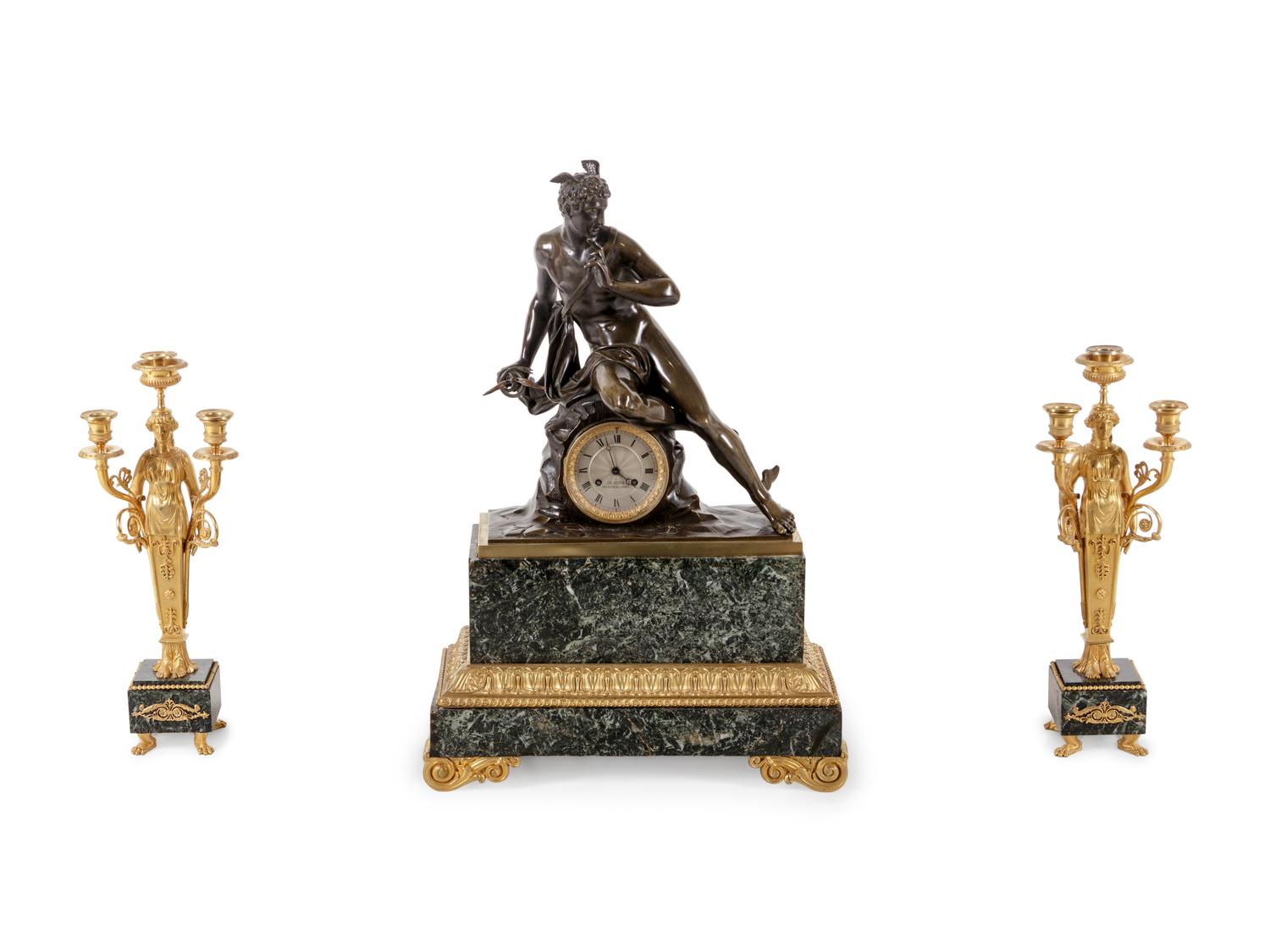 An Empire Style Gilt and Patinated Bronze and Marble Clock Garniture
