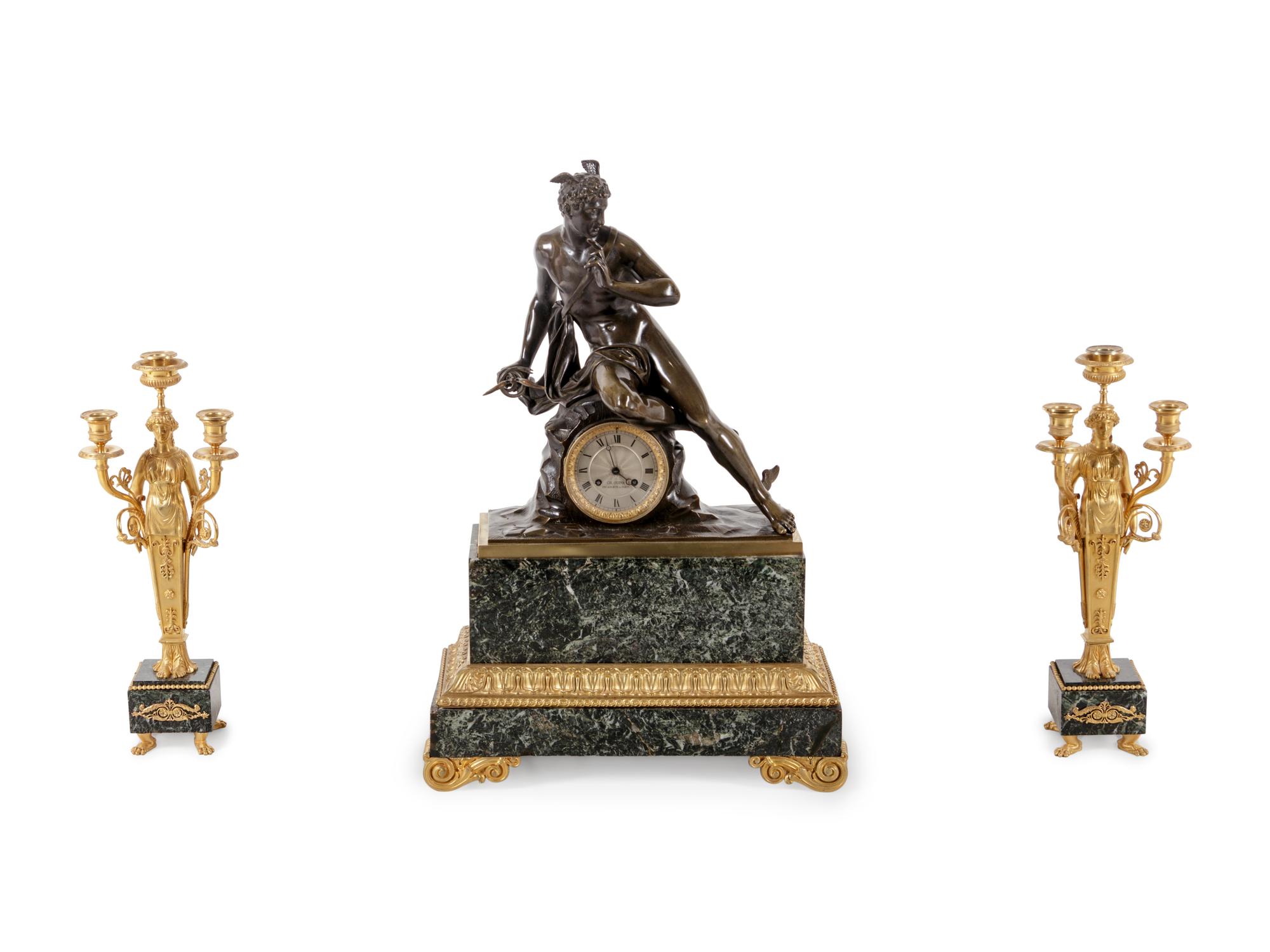 An Empire Style Gilt and Patinated Bronze and Marble Clock Garniture