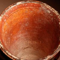 A Maya Polychrome Vessel with Rattle Feet