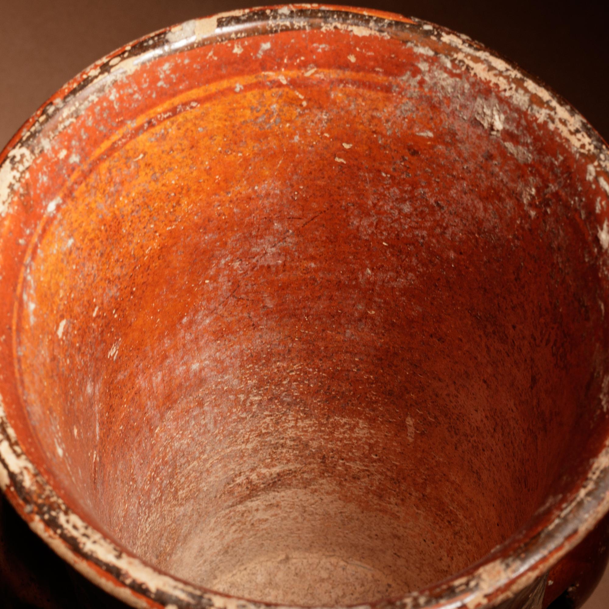 A Maya Polychrome Vessel with Rattle Feet