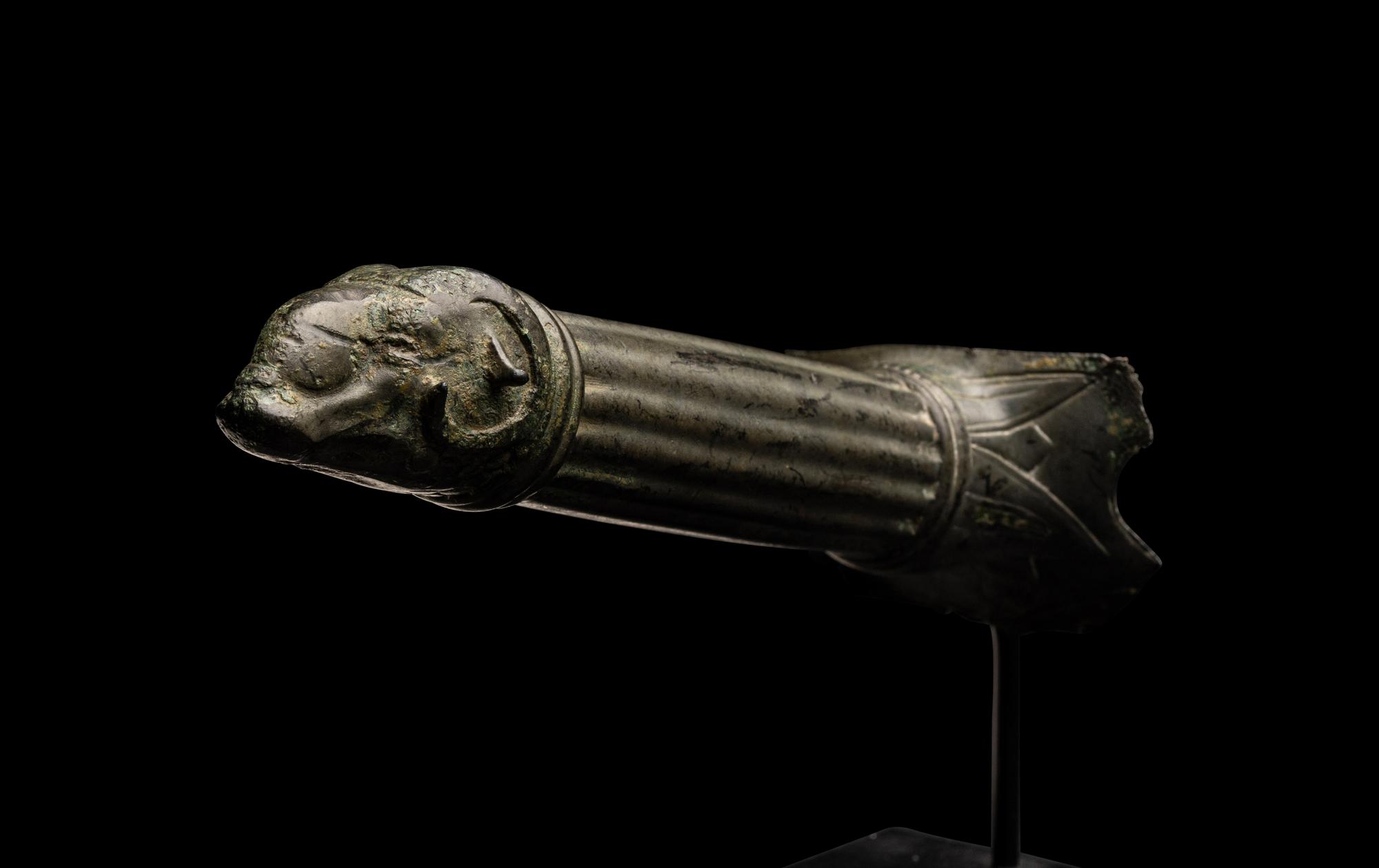 A Roman Bronze Handle with a Ram's Head