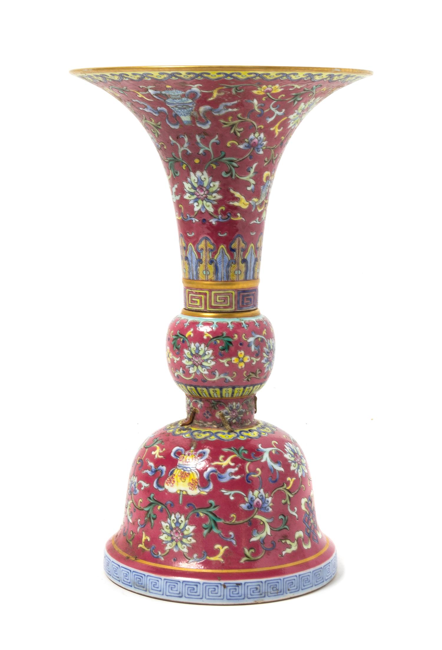A Ruby-Ground Famille Rose Porcelain Gu -Form Vase Height 11 inches.