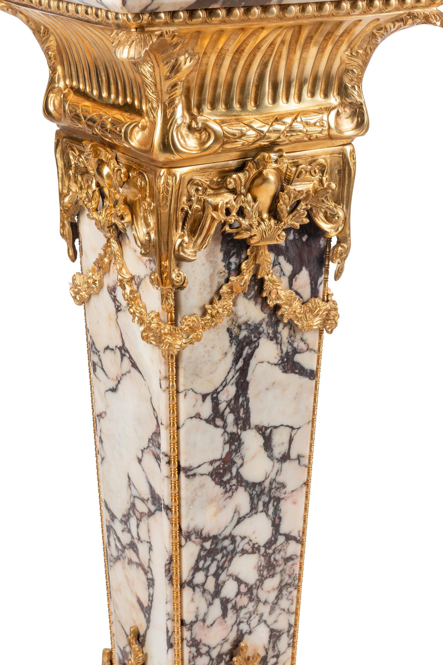 A Pair of Louis XVI Style Gilt Bronze Mounted Marble Pedestals